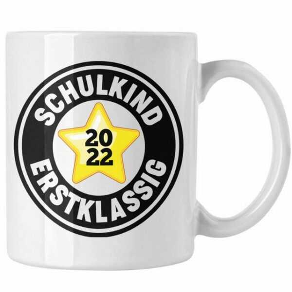 Trendation Tasse "Trendation - Schulkind Erstklassig Einschulung Junge Mädchen Geschenk Schultüte Füllung Tasse Schulstart 1. Schultag Schuleinführung Schulanfang Geschenkidee Schulkind 2022"